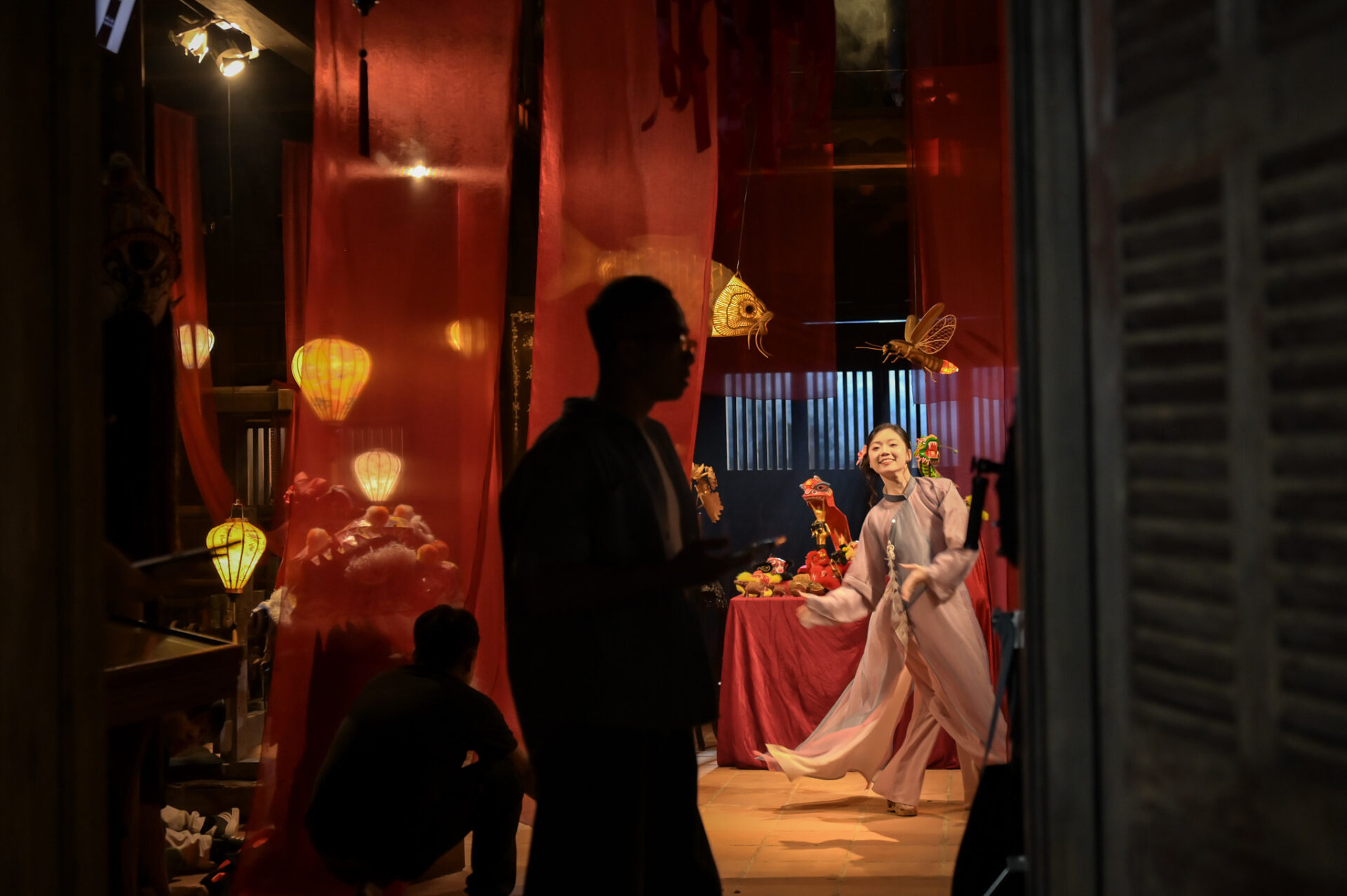 CINEFY crew filming a traditional set with a dancer in white ao dai in Da Nang, the raw footage that video editing turns into a finished film.