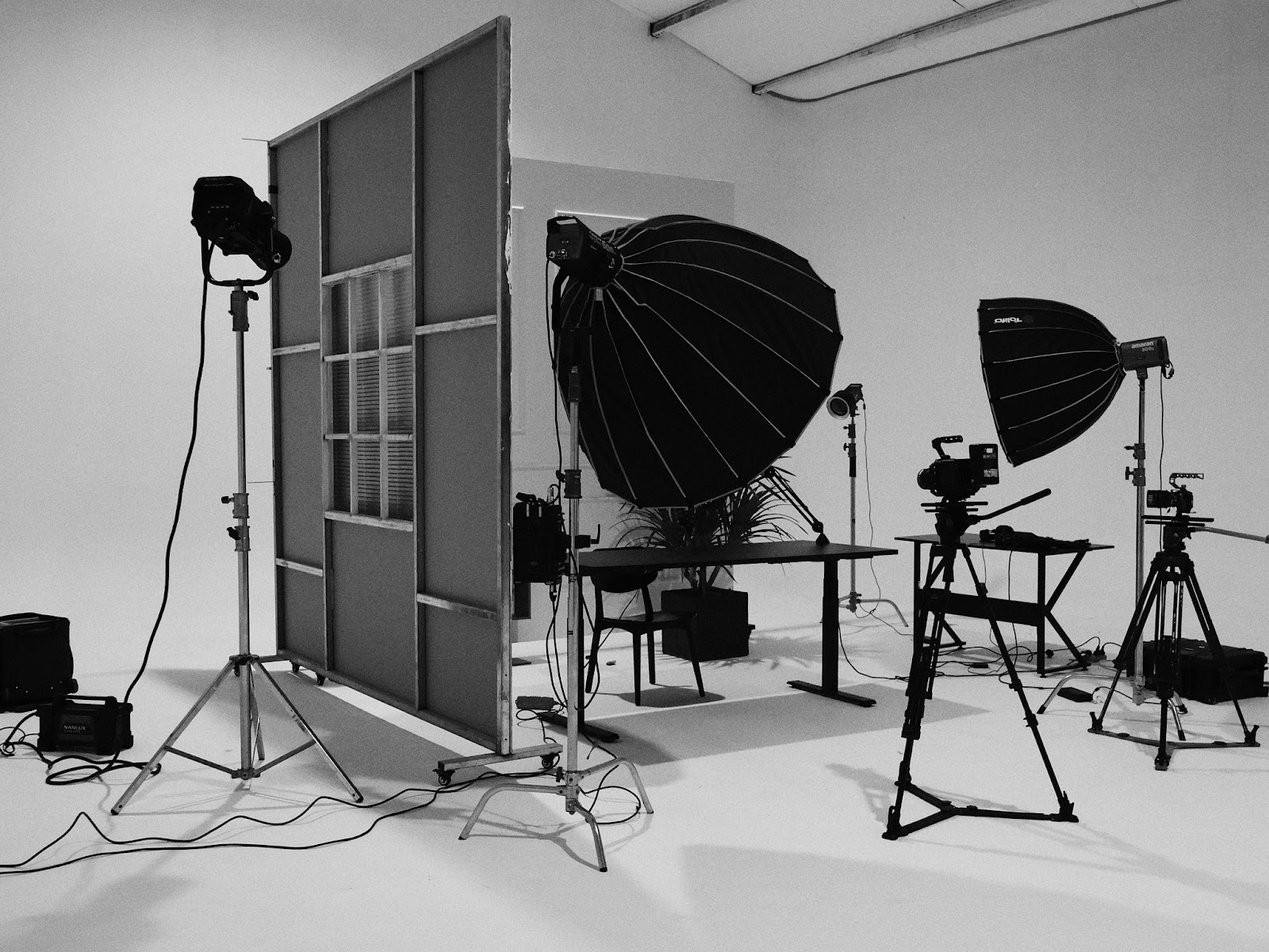 Lighting fixtures, softboxes and set flats prepared for a shoot at CINEFY studio in Da Nang