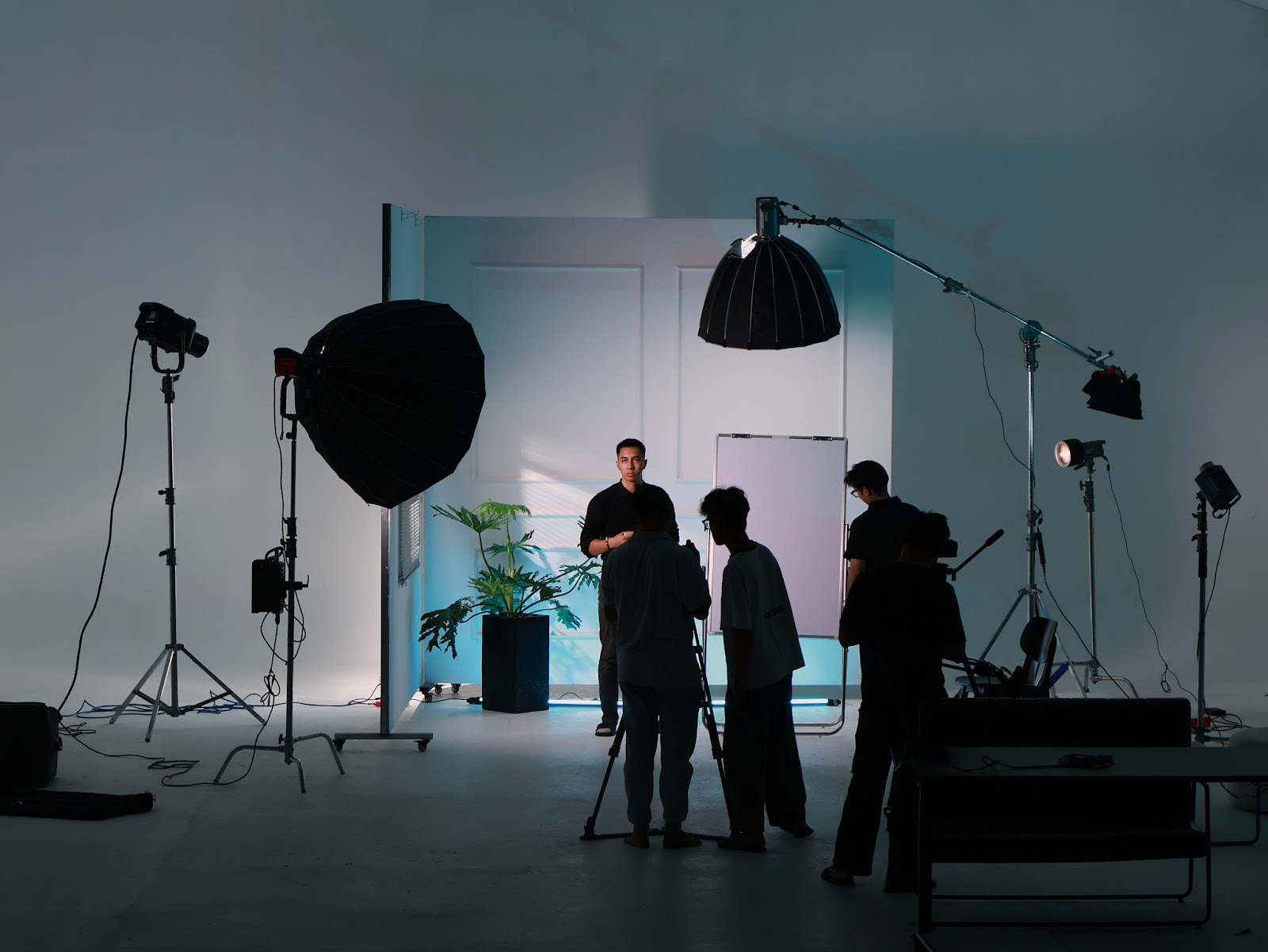 CINEFY crew preparing the set and lighting for a podcast client near Ngu Hanh Son Da Nang.