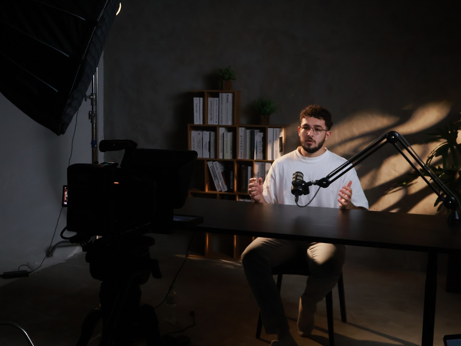Guest recording a talking-head video at the podcast studio near Ngu Hanh Son Da Nang under studio lighting.