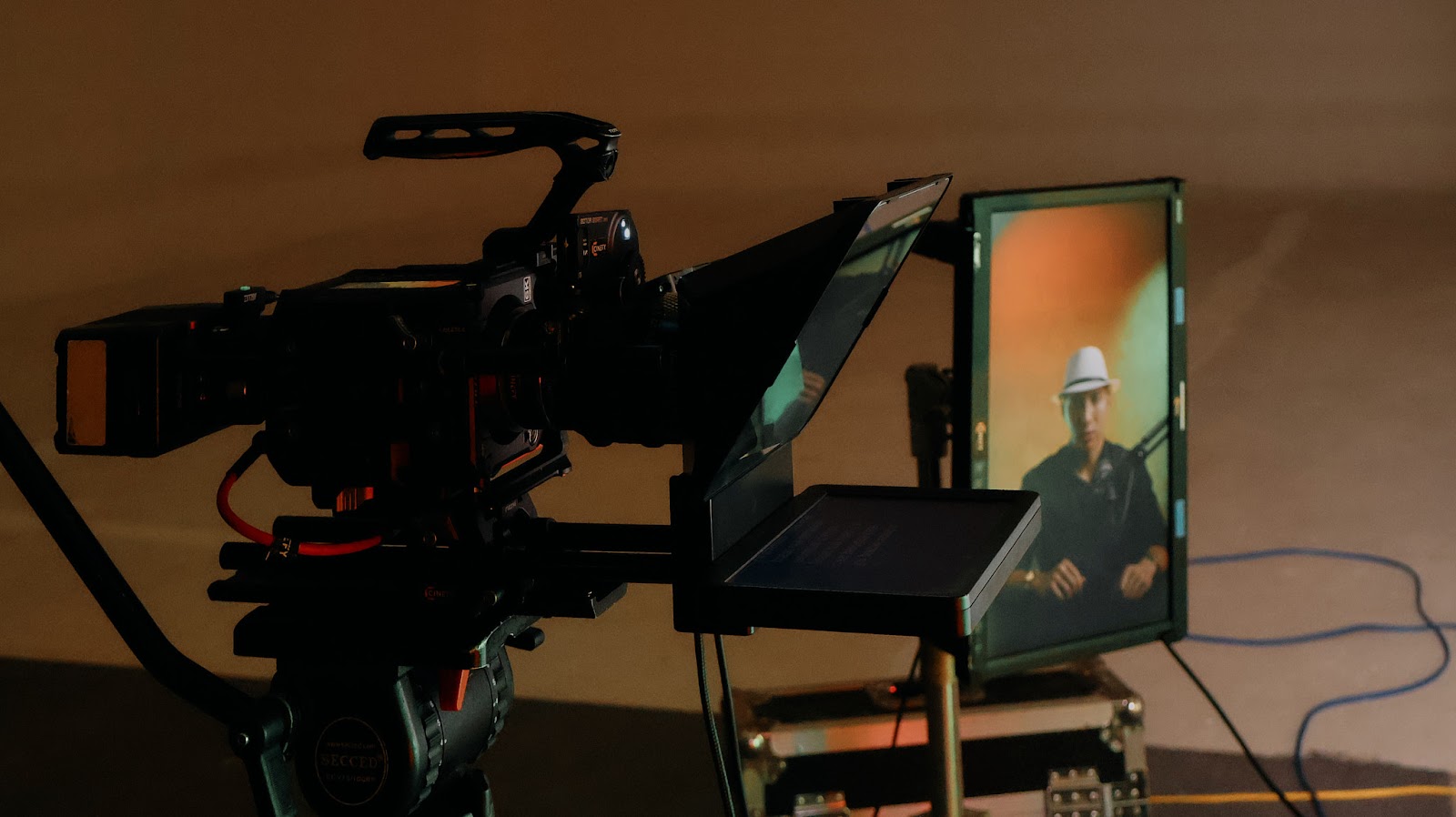 Teleprompter mounted in front of a cinema camera during a podcast shoot in Da Nang