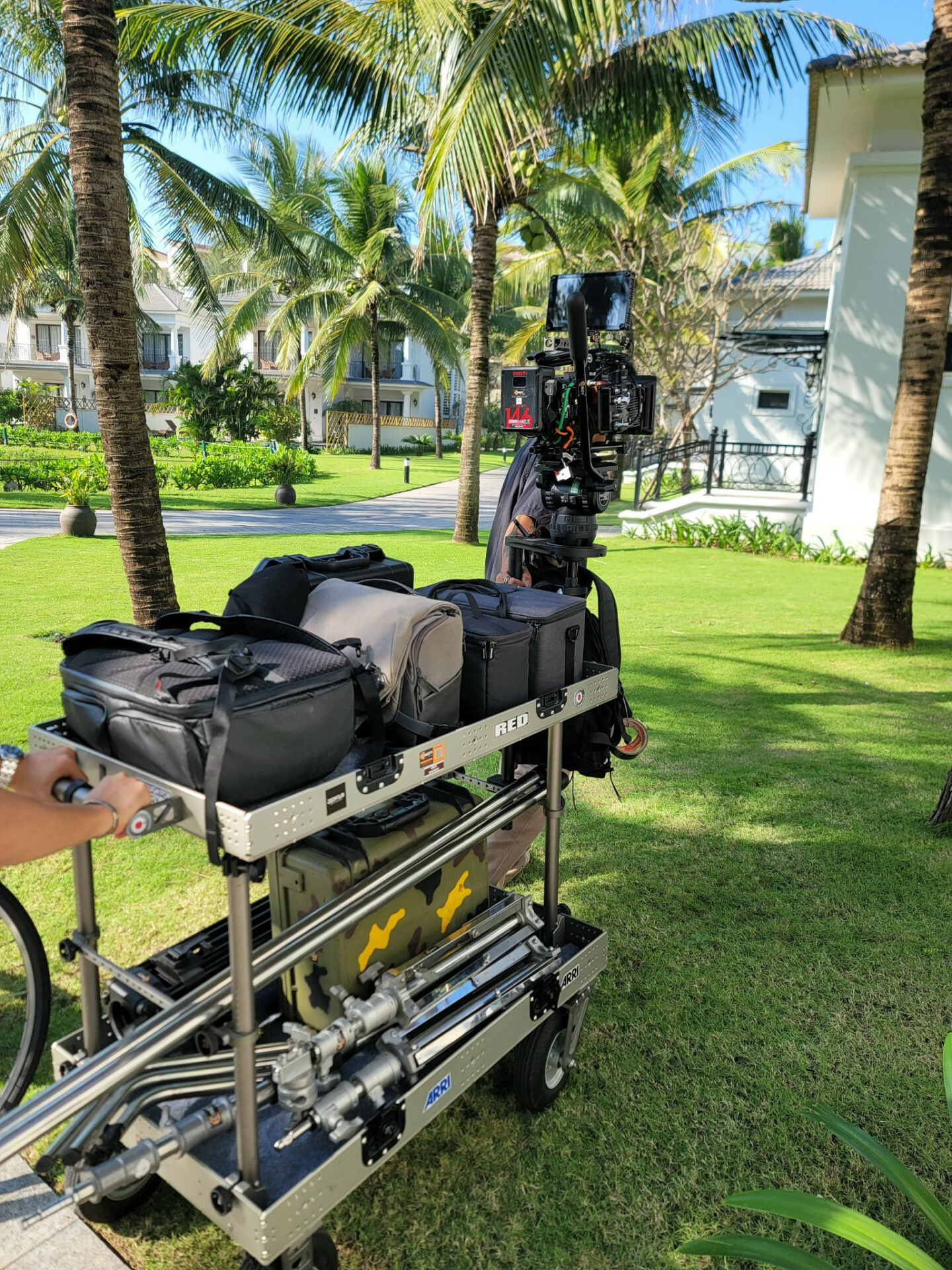 Equipment cart and camera cases prepared before a production shoot in Da Nang