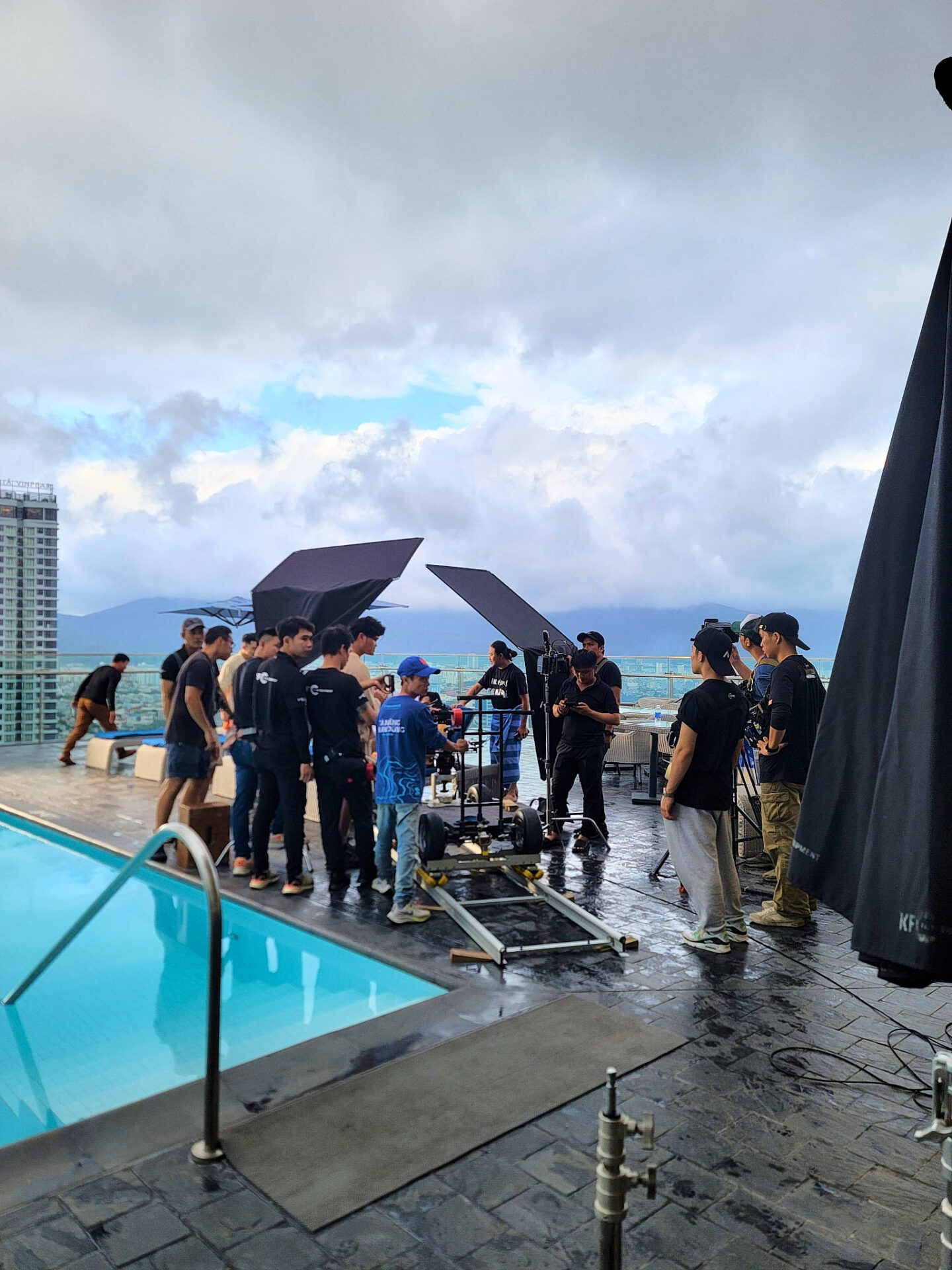 CINEFY film crew setting up a camera and light flags for an outdoor shoot in Da Nang