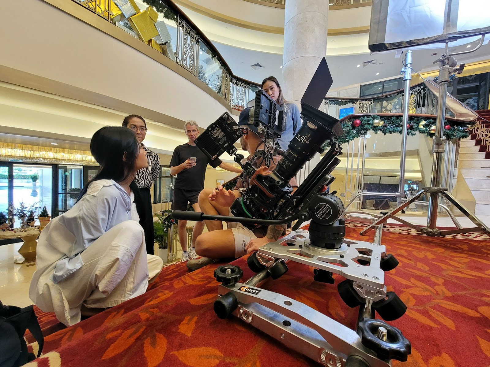 CINEFY crew operating a camera on a slider during a shoot with talent in Da Nang