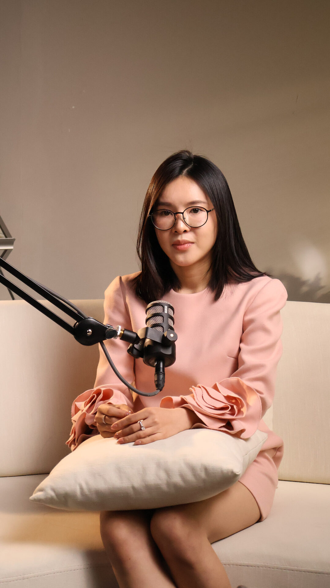 Podcast guest seated with a boom microphone in the CINEFY studio in Da Nang